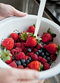 Freshly washed berries in a colander