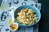 Sweet pasta with apples and raisins