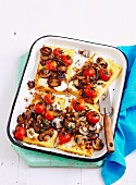Gluten-free polenta slices with mushrooms and cherry tomatoes