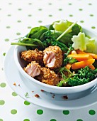 Crispy breaded salmon with steamed broccoli and carrot sticks