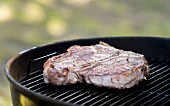 Porterhouse steak on a barbecue