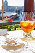 Aperol Spritz on the terrace of the Monaco Hotel on the Canal Grande, Venice, Italy