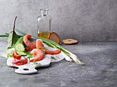 An arrangement of prawns and salad ingredients