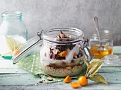 Porridge with grapes and physalis in a jar