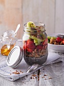 Crispy chia pudding with fruits in a jar