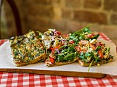 Focaccia with herbs, vegetables and rocket