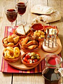 An arrangement of various tapas on a serving board