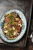 Prime boiled beef salad with apple and pumpkin seed oil vinaigrette