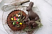 Chocolate tart with caramelised thyme, sugar eggs and chocolate Easter bunnies