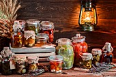 Various jars of preserved mushrooms and vegetables