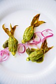 Sstuffed courgette flowers with almond sauce, Italy
