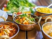 Vegetable curries with rice in an Indian restaurant