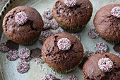 Chocolate and cherry muffins decorated with chocolate jazzies