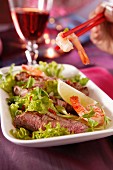 Oriental salad with beef and prawns