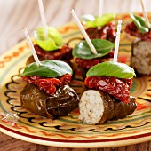 Stuffed vine leaves with dried tomatoes and basil