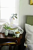 Chamomile tea to treat a cold on a bedside table