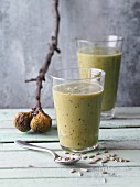 Fig and avocado smoothies with plums, sunflower seeds and spirulina