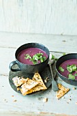 Red cabbage and coconut soup with mint and sesame seed crisps