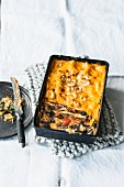 Vegetarian and chard curry lasagne with cherries and cashew nuts