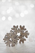 Wooden snowflakes against blurred background
