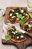 Vegetarian cauliflower pizza with spinach and ricotta