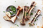 Roasted marrow bones with a parsley, shallot and lemon juice germolata seasoned with salt and pepper
