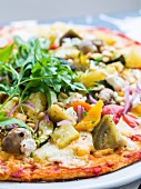 Vegetarian pizza with vegetables and rocket