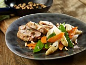 Chicken breast with pine nuts and spring vegetables