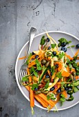 Carrot and courgette salad with blueberries and capers