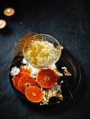 Kulfi (Indian ice cream) with oranges and coconut