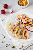 Lemon chicken breast with a sweetcorn and radish salad