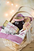 A gift basket with cheese, onion chutney and crackers for Christmas