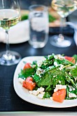 Summer salad with spinach, watermelon and goat's cheese