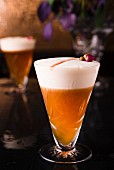 Pinot Noir Sour: a cocktail made with Pinot Noir syrup, grape juice and egg white