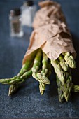 Green asparagus in a paper bag