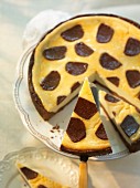 Zupfkuchen (a cheesecake and chocolate cake combination), sliced, on a cake stand