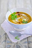 Carrot soup with sour cream and parsley