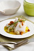 Preserved cod with mushrooms and broad beans