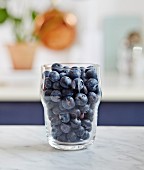A glass of fresh blueberries