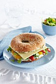 Bagel filled with Gouda, grilled peppers and cream cheese