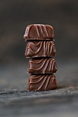 A stack of four chocolate pralines