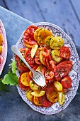 Juicy tomato salad with red and yellow tomatoes