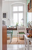 Vintage dining table and chairs in kitchen of period apartment