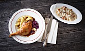 Duck leg with red cabbage and a mushroom risotto (seen from above)