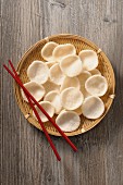 Prawn crackers in a bamboo basket