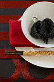 Oriental place setting in red, black and white