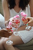 Sparkling wine with raspberries, pomegranate seeds and cotton candy