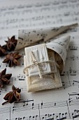 Springerle (anise biscuits with an embossed design) in a cone made from sheet music with star anise