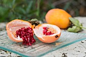 A sliced passion fruit on a table outside