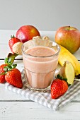A strawberry and banana smoothie with apple and ginger